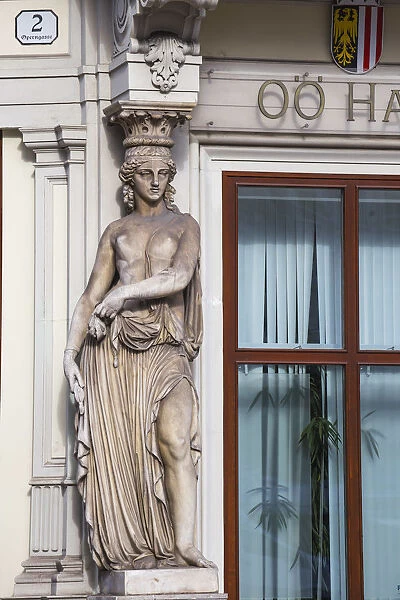 Austria, Vienna, Historic centre, Female statue on the facade of a building