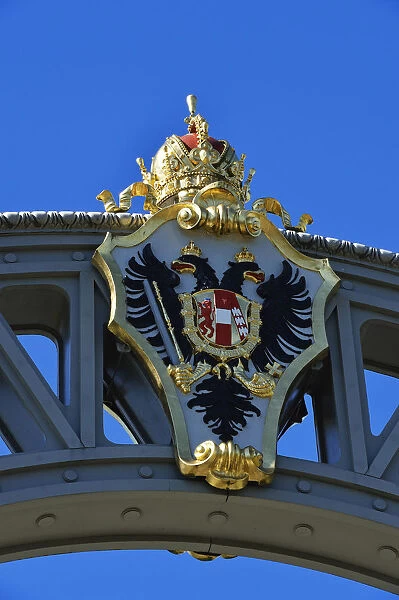 Austrian coat of arms on the countries bridge between Bavaria and Salzburg, running
