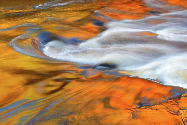 AUtumn colors reflected in Lower Rosseau Falls at sunset Rosseau, Ontario, Canada