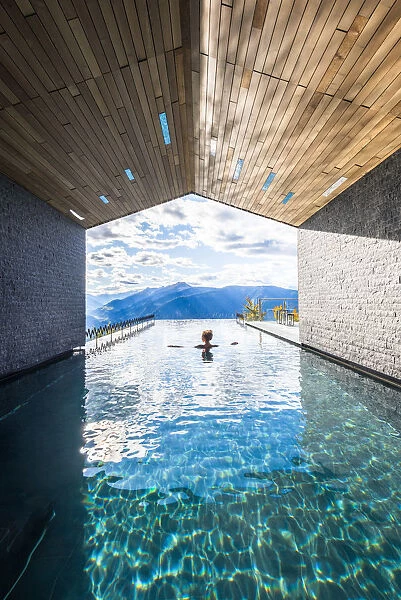 Avelengo, Bolzano province, Trentino Alto Adige, Italy Girl relaxes in the pool