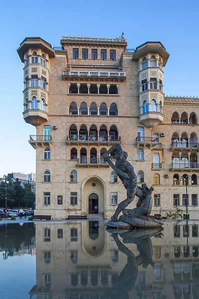 Azerbaijan, Baku, Residential building reflecting in Bharam fountain