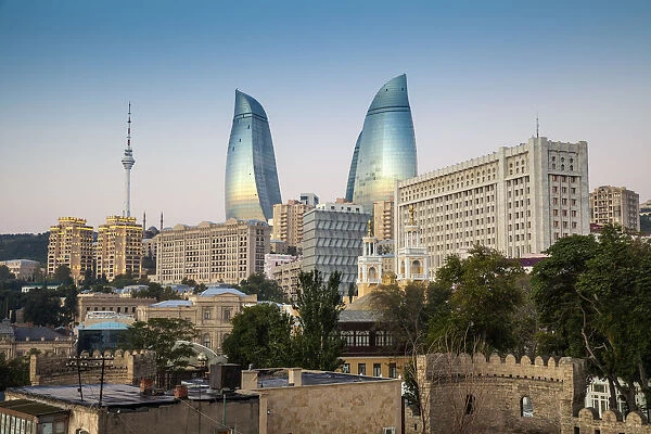 Azerbaijan, Baku, View looking over the walls of the old town to the Flame Towers