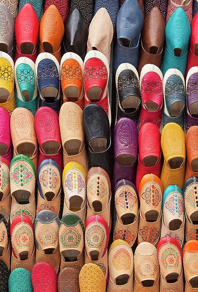 Babouches colorful traditional Moroccan slippers on sale in a shop of the medina of Fez, Morocco. The medina of Fes was declared UNESCO World Heritage Site in 1981