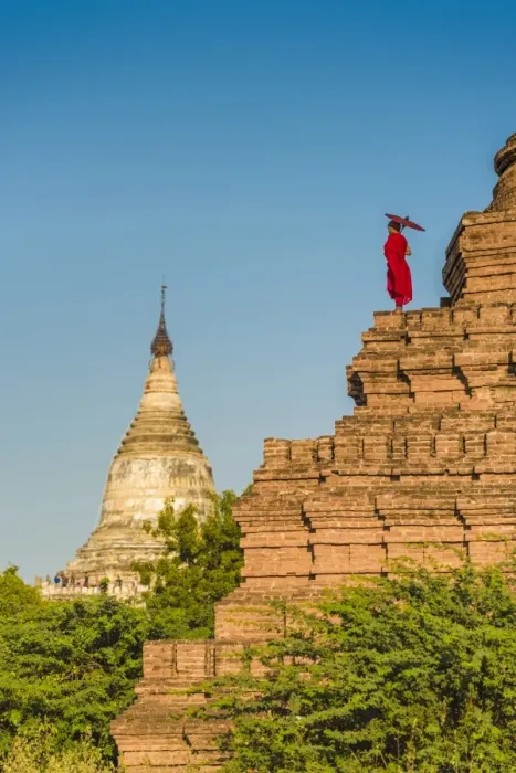 Framed Print : Bagan, Mandalay region, Myanmar (Burma). A young monk watching the Shwesandaw pagoda Framed Print : Bagan, Mandalay region, Myanmar (Burma). A young monk watching the Shwesandaw pagoda
