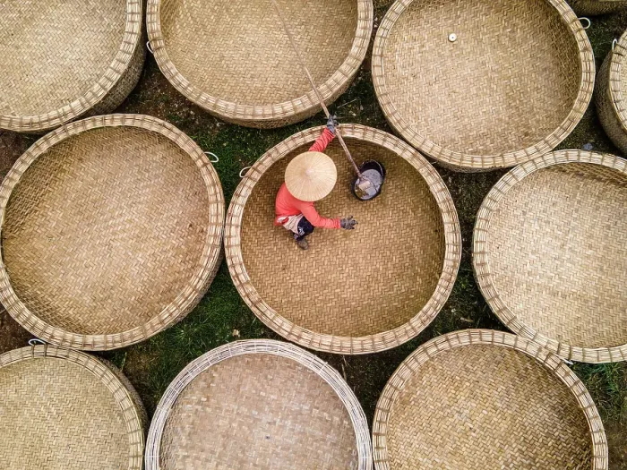 Framed Print : Bamboo basket fishing boats known as Thung Chai being waterproofed at An Dan village, Phu Yen Province, Vietnam Framed Print : Bamboo basket fishing boats known as Thung Chai being waterproofed at An Dan village, Phu Yen Province, Vietnam