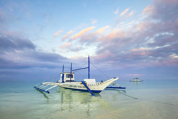 Bangka outrigger boat at sunrise on White Beach, Boracay Island, Aklan Province, Western