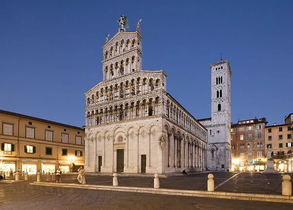Basilica church of San Michele in Foro lit up at night, Lucca, Tuscany, Italy