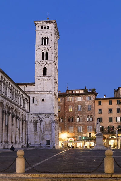 Basilica church of San Michele in Foro lit up at night, Lucca, Tuscany, Italy
