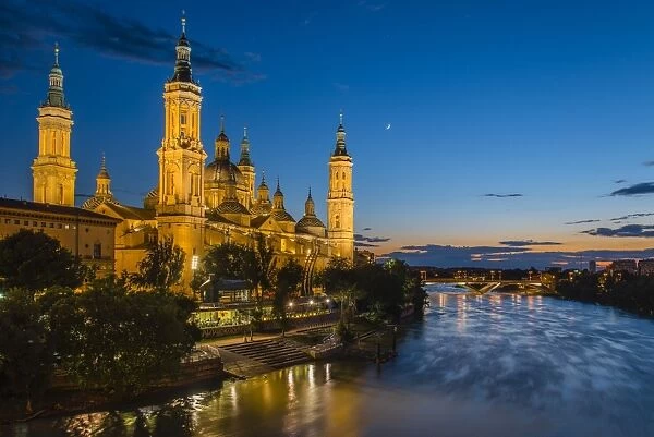 Basilica de Nuestra Senora del Pilar church and Ebro river at dusk, Zaragoza, Aragon