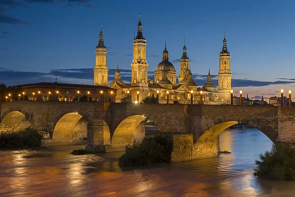 Basilica de Nuestra Senora del Pilar church and Ebro river at dusk, Zaragoza, Aragon
