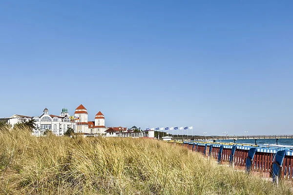 Beach baskets, dunes and Kurhaus, Binz, RAogen Island, Mecklenburg-Western Pomerania