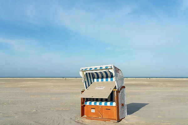 Beach chair on beach against sky, Norddorf, UNESCO, Amrum island, Nordfriesland, Schleswig-Holstein, Germany
