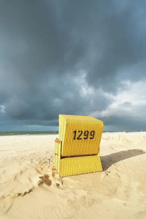 Framed Print : Beach chair against cloudy dramatic sky, Wenningstedt beach, Sylt, Nordfriesland, Schleswig-Holstein, Germany Framed Print : Beach chair against cloudy dramatic sky, Wenningstedt beach, Sylt, Nordfriesland, Schleswig-Holstein, Germany