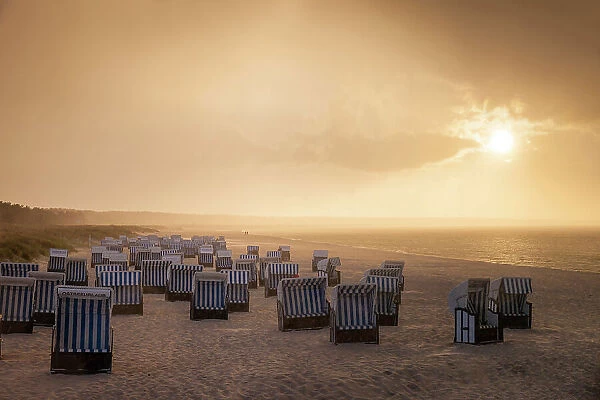 Beach chairs with rain clouds with sunset in Prerow, Mecklenburg-Western Pomerania, Baltic Sea, North Germany, Germany