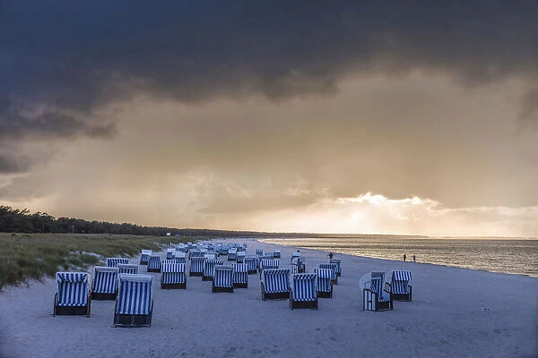 Beach chairs with storm clouds in Prerow, Mecklenburg-Western Pomerania, Northern Germany