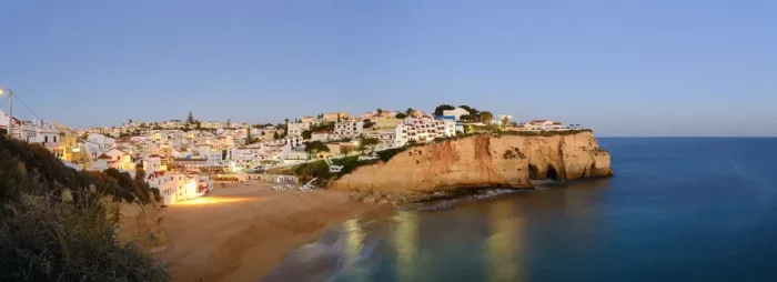 Framed Print : The beach and village of Carvoeiro at dusk. Lagoa, Algarve, Portugal