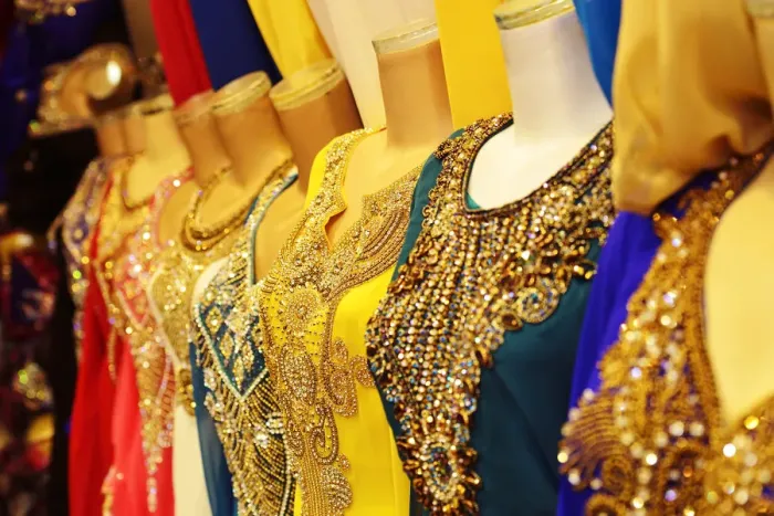 Framed Print : Beaded womens dresses on sale at the Dubai Souk, Deira, Dubai, United Arab