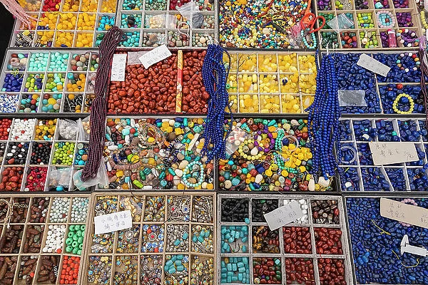 Beads displayed on stall at Panjiayuan Market, Beijing, China