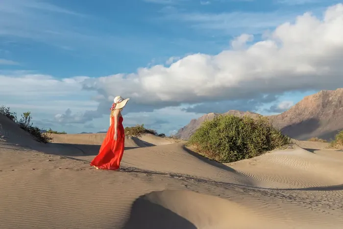 Framed Print : Beautiful girl with red dress walks in the sand dunes of Famara, Lanzarote, Canary Island, Spain Framed Print : Beautiful girl with red dress walks in the sand dunes of Famara, Lanzarote, Canary Island, Spain
