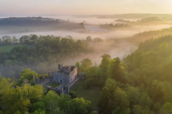 Beautiful misty sunrise above Berry Pomeroy Castle, Devon, England. Spring (May) 2023