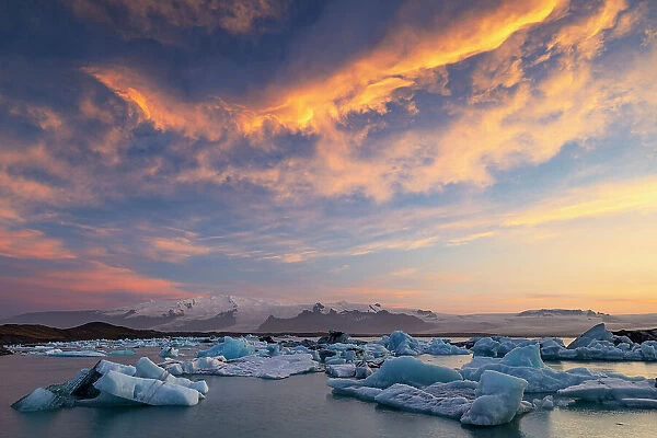 a beautiful summer sunset at Jokusarloon glacier Lagoon with many iceberg in the bay, Iceland