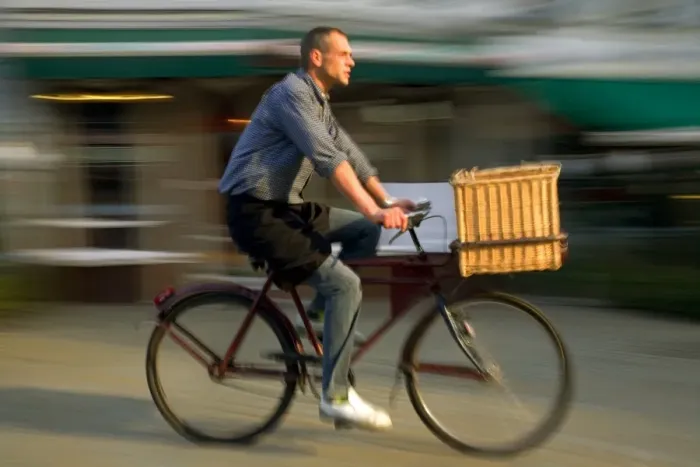 Framed Print : Belgium, Flanders, Antwerp; A man cycling, a common form of transport in the city Framed Print : Belgium, Flanders, Antwerp; A man cycling, a common form of transport in the city