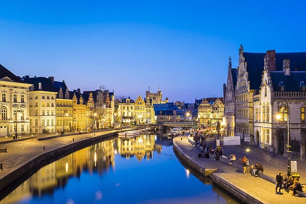 Belgium, Flanders, Ghent (Gent). Buildings along the Leie River and Graslei quay at dusk