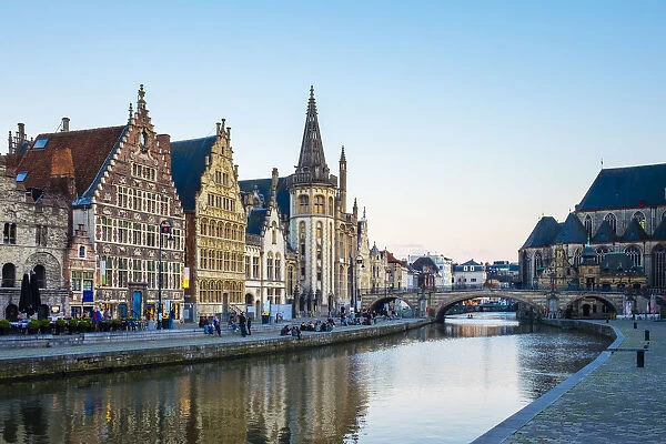 Belgium, Flanders, Ghent (Gent). The Leie River and buildings along Graslei quay at dusk