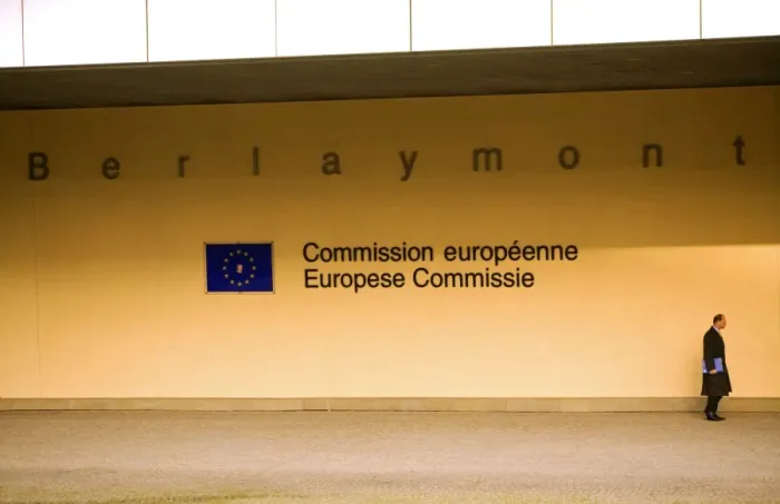Framed Print : Belgium, Wallonia, Brussels; A beaurocrat passing in front of the European Commision Headquarters in Framed Print : Belgium, Wallonia, Brussels; A beaurocrat passing in front of the European Commision Headquarters in
