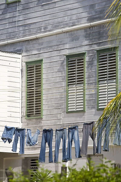 Belize, Belize City, Fort George District, Jeans hanging up on washing line infront