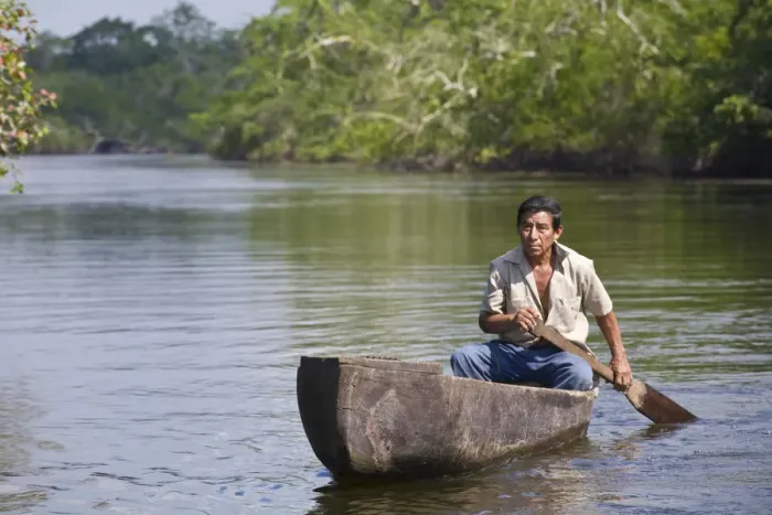 Framed Print : Belize, Lamanai, New River, Fisherman in dug out canoe