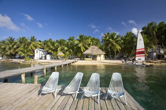 Framed Print : Belize, Tobaco Caye, Chairs on jetty Framed Print : Belize, Tobaco Caye, Chairs on jetty