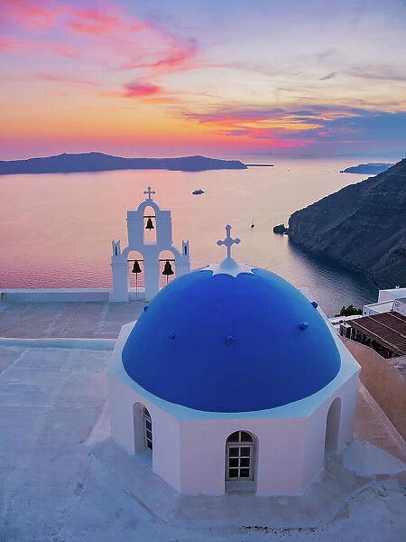 Three Bells of Fira, iconic blue domed church at sunset, Fira, Santorini or Thira Island, Cyclades, Greece