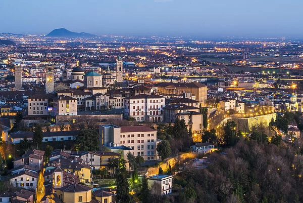 Bergamo, Lombardy, Italy. High angle view over Upper Town (Citta Alta) at dusk