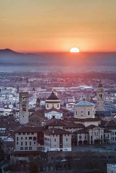Bergamo, Lombardy, Italy. High angle view over Upper Town (Citta Alta) at sunrise