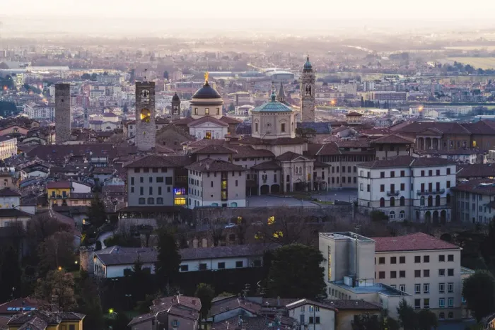 Framed Print : Bergamo, Lombardy, Italy. High angle view over Upper Town (Citta Alta) at dusk Framed Print : Bergamo, Lombardy, Italy. High angle view over Upper Town (Citta Alta) at dusk