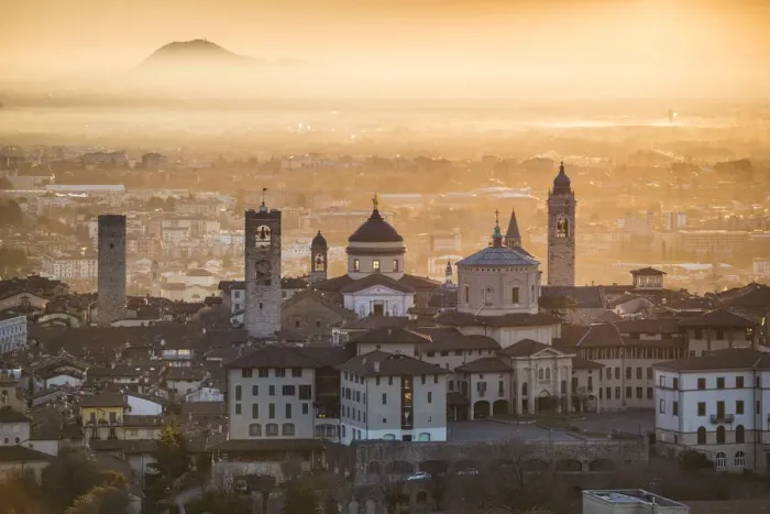Framed Print : Bergamo, Lombardy, Italy. High angle view over Upper Town (Citta Alta) at sunrise