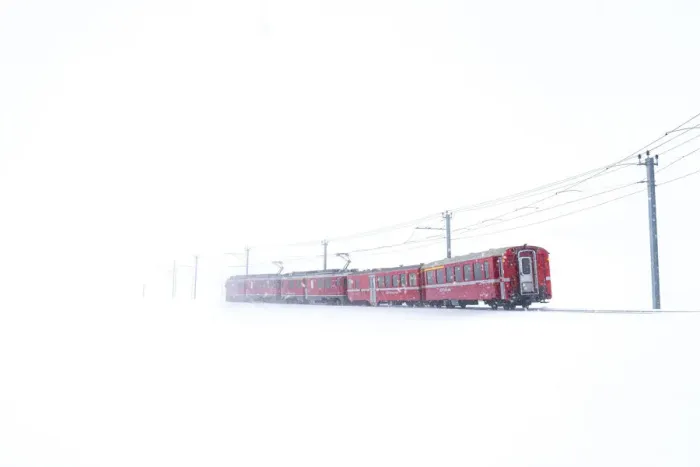 Framed Print : Bernina Express during a snowfall at Bernina Pass, Graubunden, Engadine, Switzerland Framed Print : Bernina Express during a snowfall at Bernina Pass, Graubunden, Engadine, Switzerland