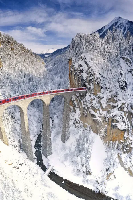 Framed Print : Bernina Express train on Landwasser viaduct during the snowy winter, Filisur Framed Print : Bernina Express train on Landwasser viaduct during the snowy winter, Filisur