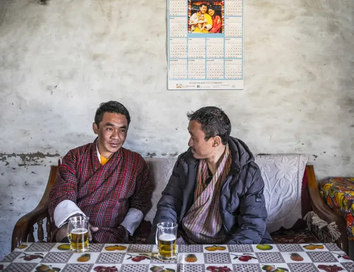 Framed Print : Two Bhutanese men drinking beer in a local bar, Ura, Bumthang District, Bhutan Framed Print : Two Bhutanese men drinking beer in a local bar, Ura, Bumthang District, Bhutan