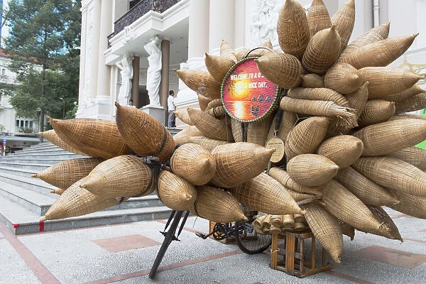 Bicycle with fishing baskets outside Opera House, Ho Chi Minh City, Vietnam