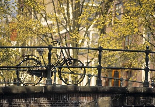 Bike on bridge, Amsterdam, Holland