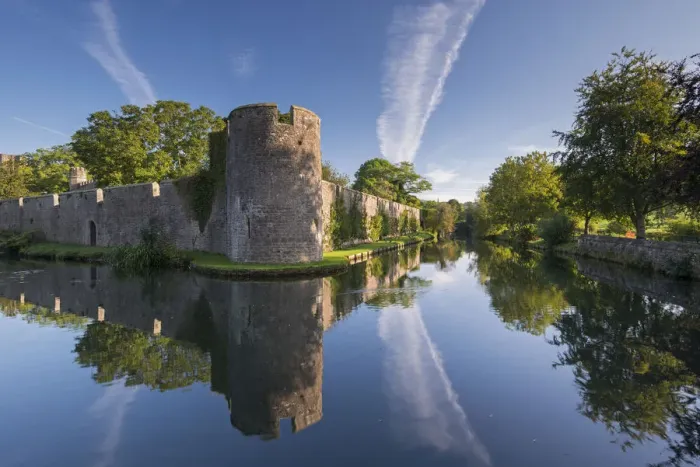 Framed Print : The Bishops Palace and moat in Wells, Somerset, England. Autumn Framed Print : The Bishops Palace and moat in Wells, Somerset, England. Autumn