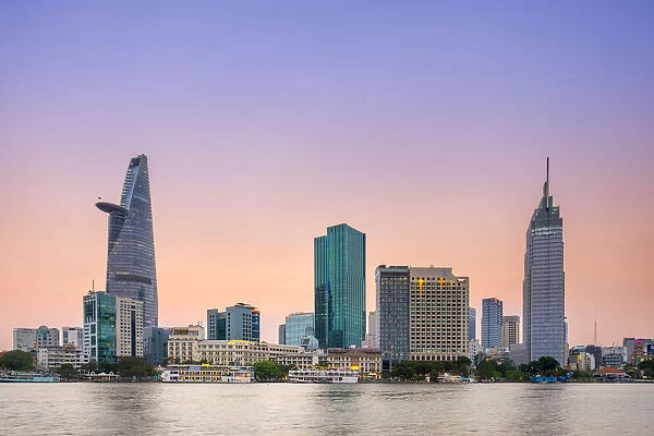 Bitexco Financial Tower and central Ho Chi Minh City (Saigon) skyline at sunset, Vietnam