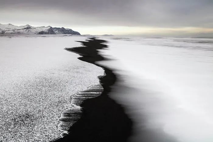 Framed Print : Black sand beach fringed by snow and surf, near Jokulsarlon, South Iceland Framed Print : Black sand beach fringed by snow and surf, near Jokulsarlon, South Iceland