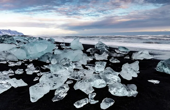 Framed Print : Black volcanic sand beach covered in icebergs from Jokulsarlon glacier lagoon, at dawn, Southeast Iceland Framed Print : Black volcanic sand beach covered in icebergs from Jokulsarlon glacier lagoon, at dawn, Southeast Iceland