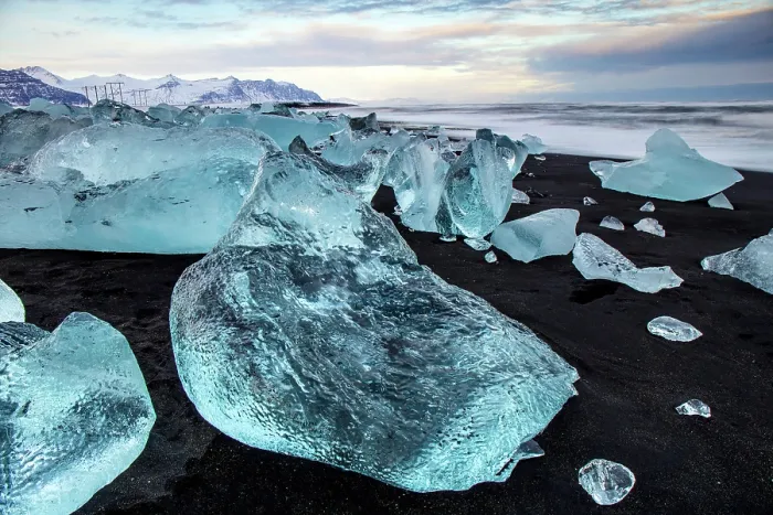 Framed Print : Black volcanic sand beach covered in icebergs from Jokulsarlon glacier lagoon at dawn, Southeast Iceland Framed Print : Black volcanic sand beach covered in icebergs from Jokulsarlon glacier lagoon at dawn, Southeast Iceland