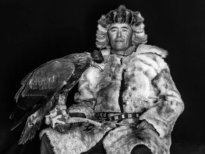 Framed Print : Black & white portrait of a Kazakh Eagle Hunter wearing traditional fur clothing and posing with his trained golden eagle, Bayan-Ulgii Province, Western Mongolia, Asia Framed Print : Black & white portrait of a Kazakh Eagle Hunter wearing traditional fur clothing and posing with his trained golden eagle, Bayan-Ulgii Province, Western Mongolia, Asia