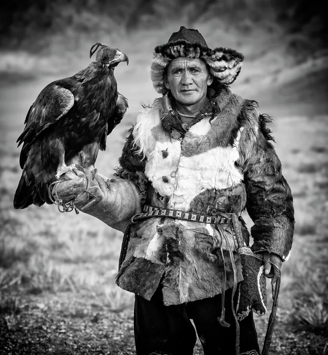 Framed Print : Black & white portrait of a Kazakh Eagle Hunter wearing traditional fur clothing and posing with his trained golden eagle, Bayan-Ulgii Province, Western Mongolia, Asia Framed Print : Black & white portrait of a Kazakh Eagle Hunter wearing traditional fur clothing and posing with his trained golden eagle, Bayan-Ulgii Province, Western Mongolia, Asia