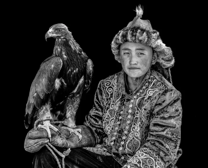 Framed Print : Black & white portrait of a young Kazakh Eagle Hunter posing with his trained golden eagle, Bayan-Ulgii Province, Western Mongolia, Asia Framed Print : Black & white portrait of a young Kazakh Eagle Hunter posing with his trained golden eagle, Bayan-Ulgii Province, Western Mongolia, Asia